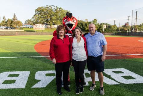 At a dedication ceremony for the softball field named in her honor, Barbara Madrigrano (right) st...